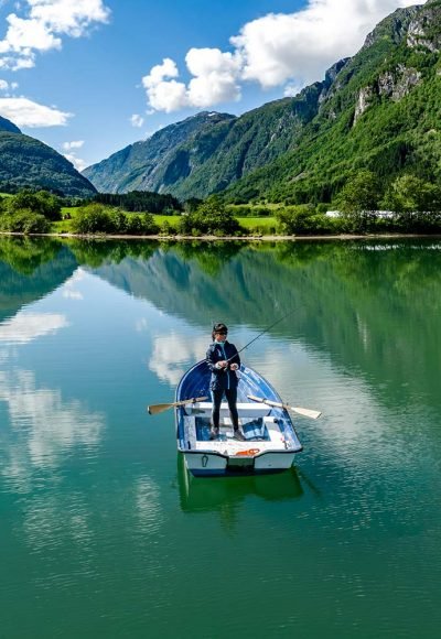 woman-fishing-on-a-boat-XM5YGAE-resize.jpg